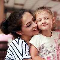 Mom and son hugging